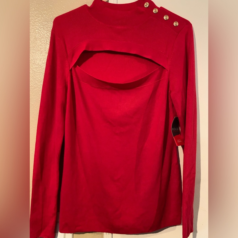 Red long sleeve open cut sweater with gold buttons on shoulder